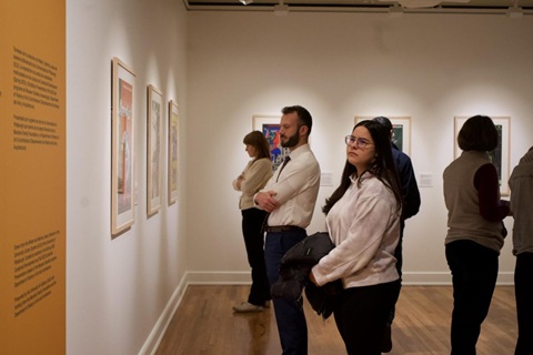 People view an exhibit in the University Art Gallery