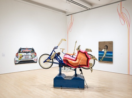An artistic representation of a lowrider bicycle in a gallery