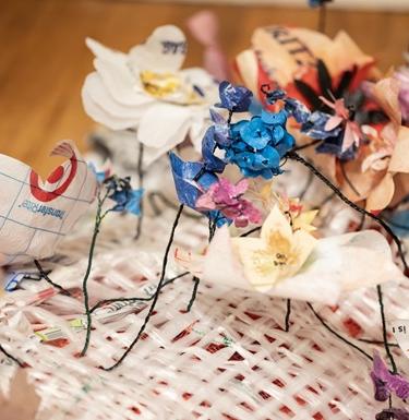Flowers made from paper in an art display